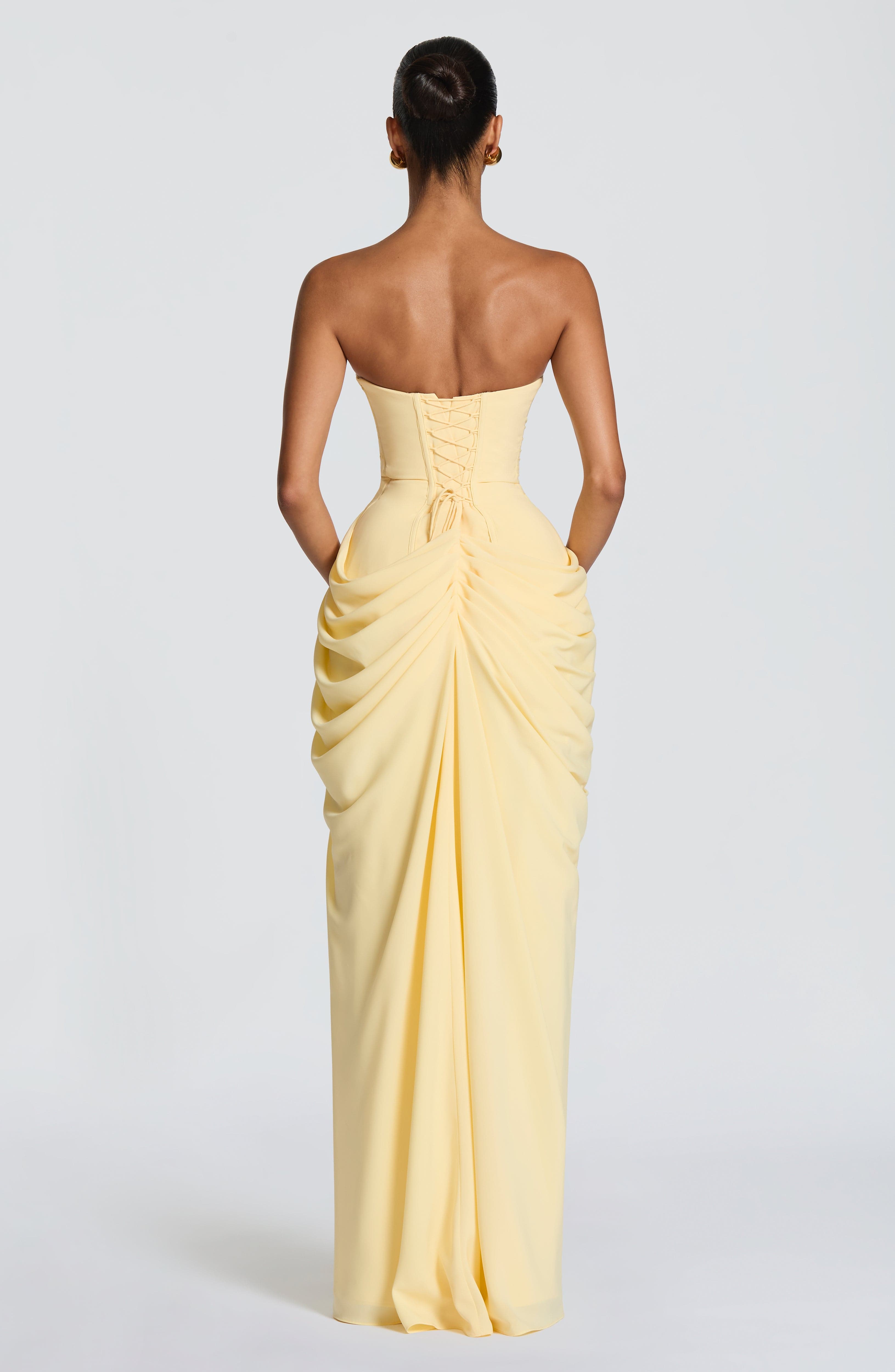 Strapless draped maxi dress with concealed side closure and maxi-length flowing skirt
