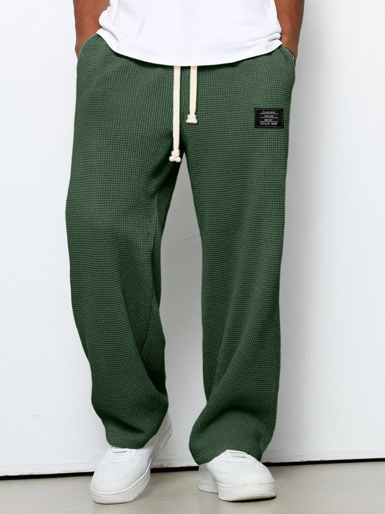 Casual men's waffle-texture knit pants with adjustable waist and relaxed leg shape