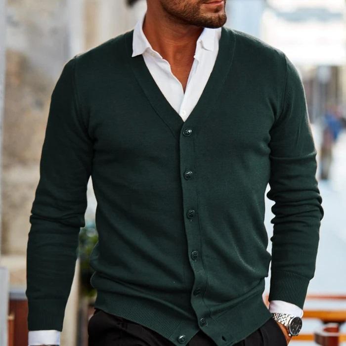 Dark navy men's button-up cardigan showing ribbed hem and cuffs detail