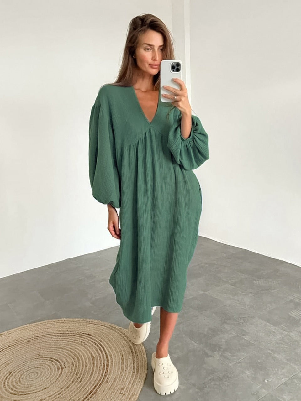 Women's loose-fit midi dress with V-neckline, long sleeves, and a straight hem in a flowing silhouette