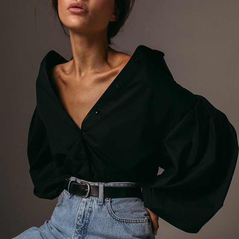 Women's woven wrap blouse with long sleeves and defined waist