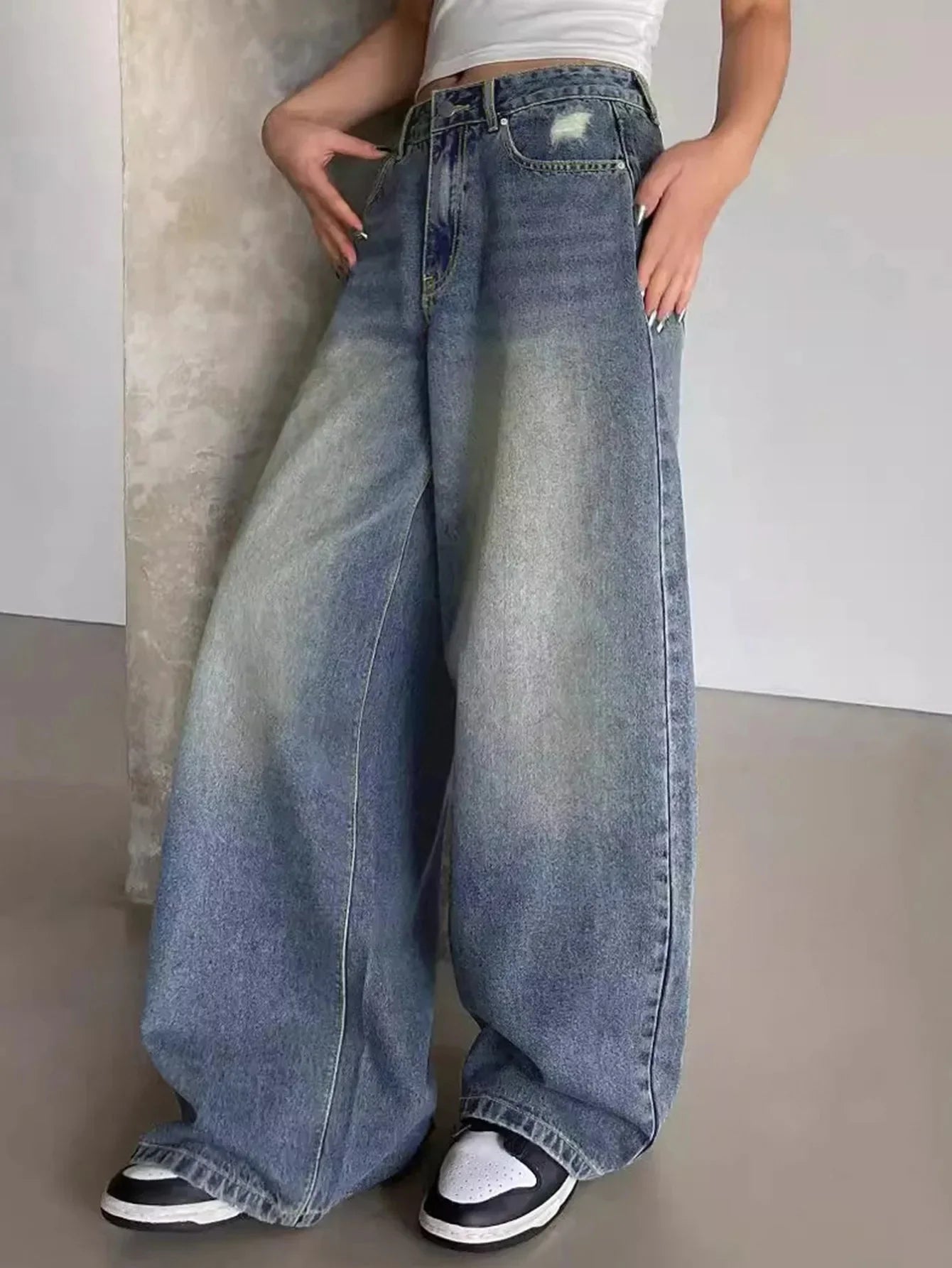 Women's wide-leg denim jeans with high waist – side profile view