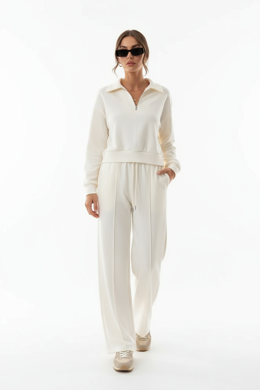 Women's relaxed-fit knit loungewear set showing sweater and drawstring trouser detail, side view