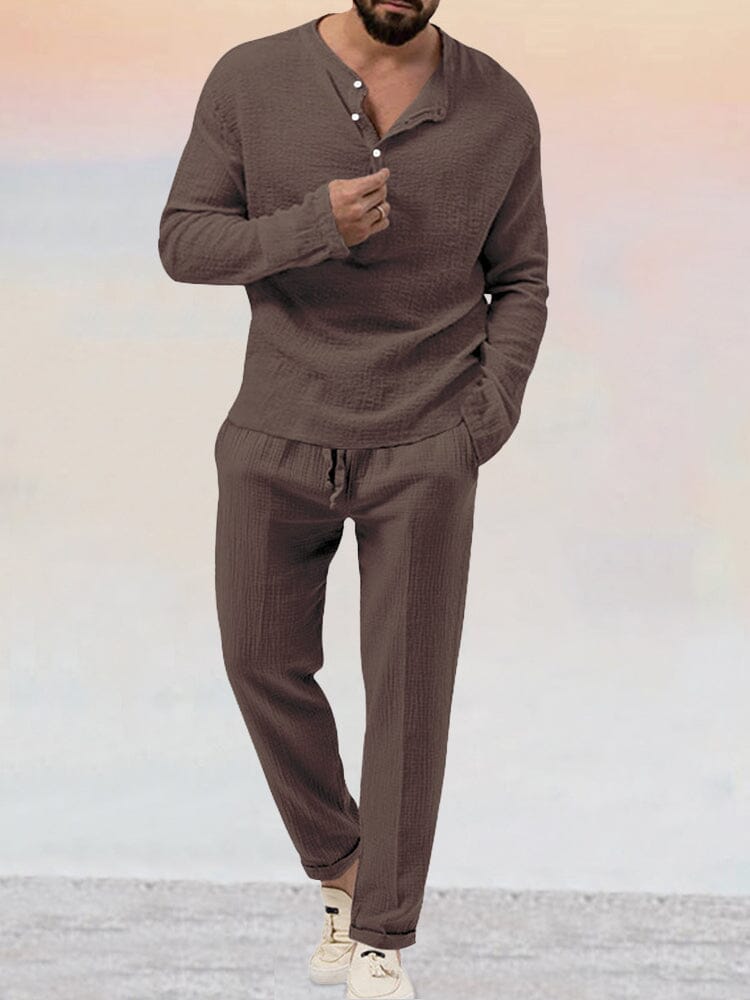 Men's two-piece lounge set with matching Henley shirt and trousers, back view showing relaxed fit