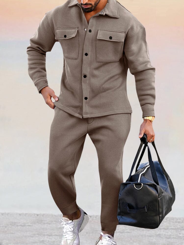 Men's casual two-piece set featuring a collared button-up top and elastic waist jogger pants, three-quarter view