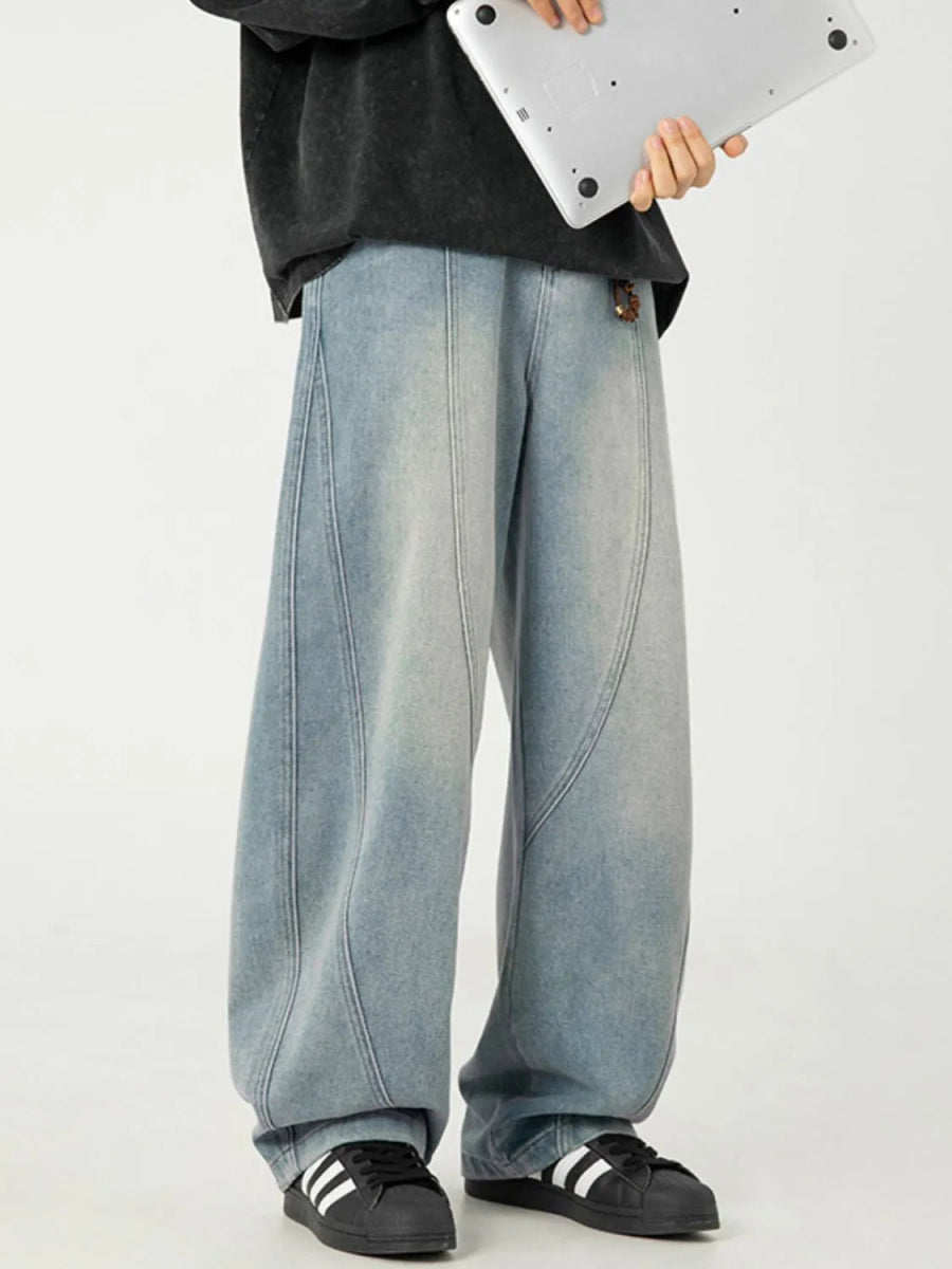 Men's wide-leg jeans with front panel seam detailing and washed denim construction