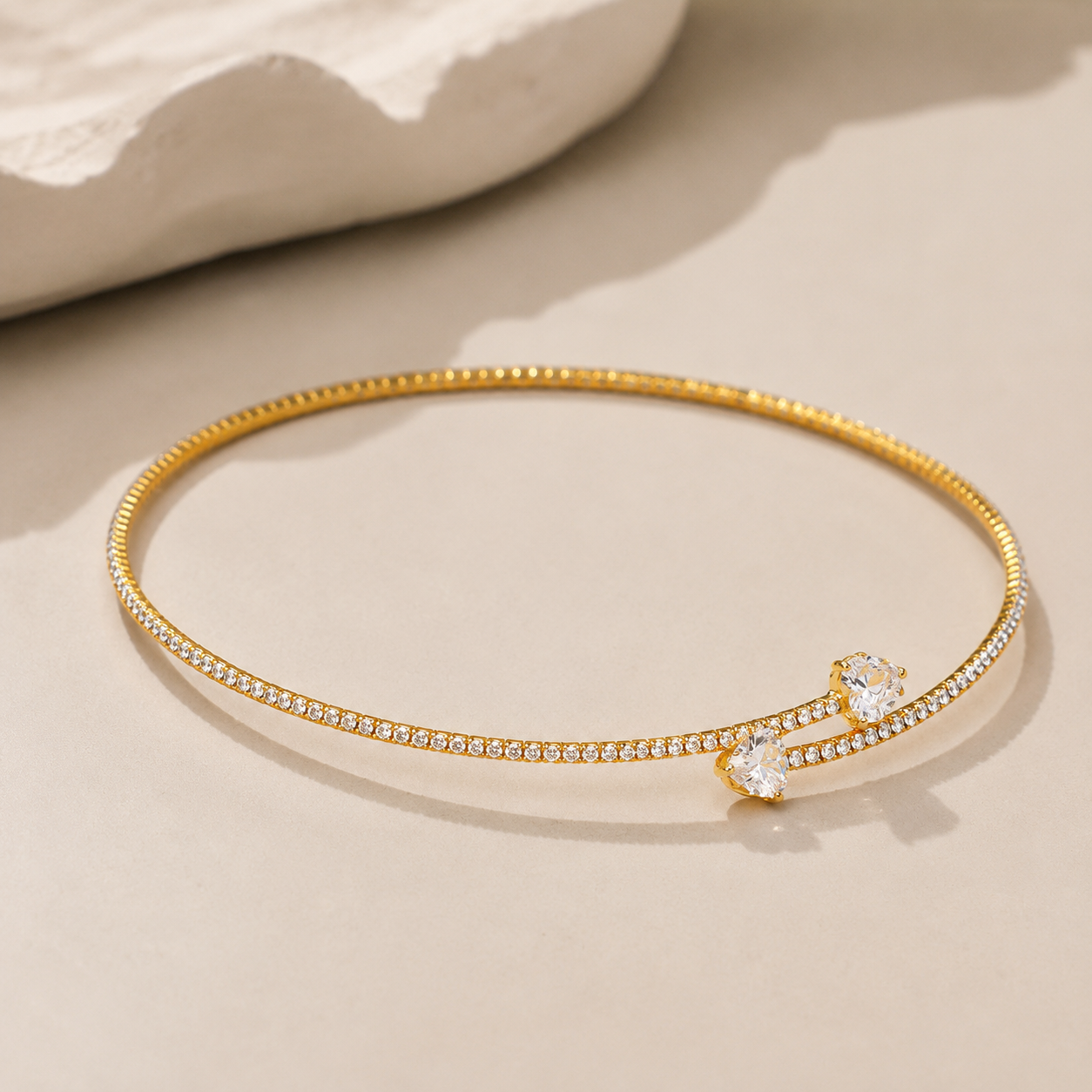 Women's metal choker necklace with zirconia stone elements and clasp closure