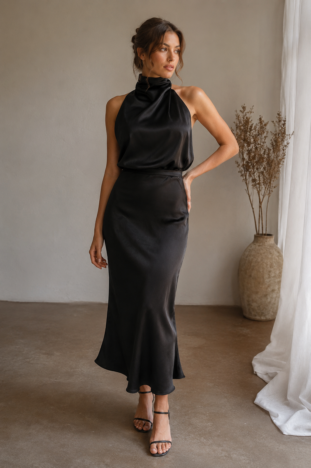 Women's satin halterneck midi dress in a pull-on style with a fluid midi-length hem