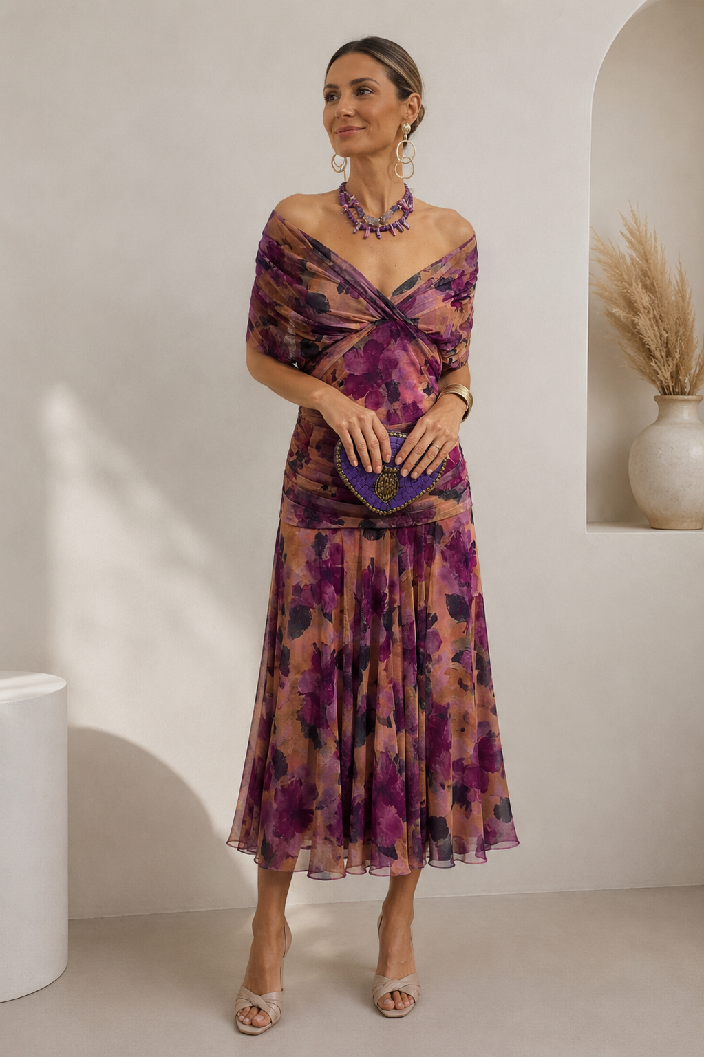Off-shoulder maxi dress with gathered waist and full-length flowing skirt