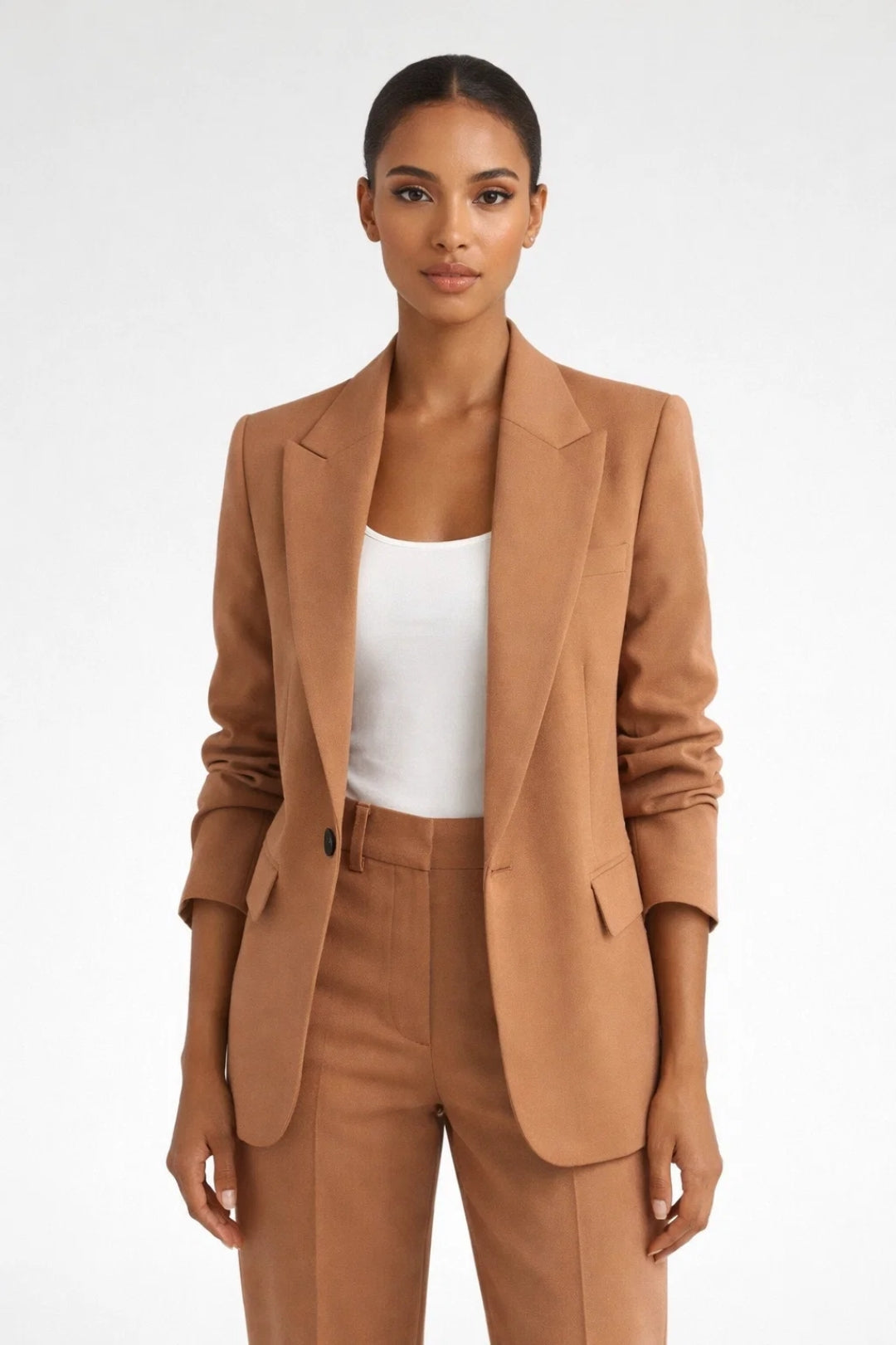 Women's tailored single-breasted blazer with lapel collar, long sleeves, and flap pockets