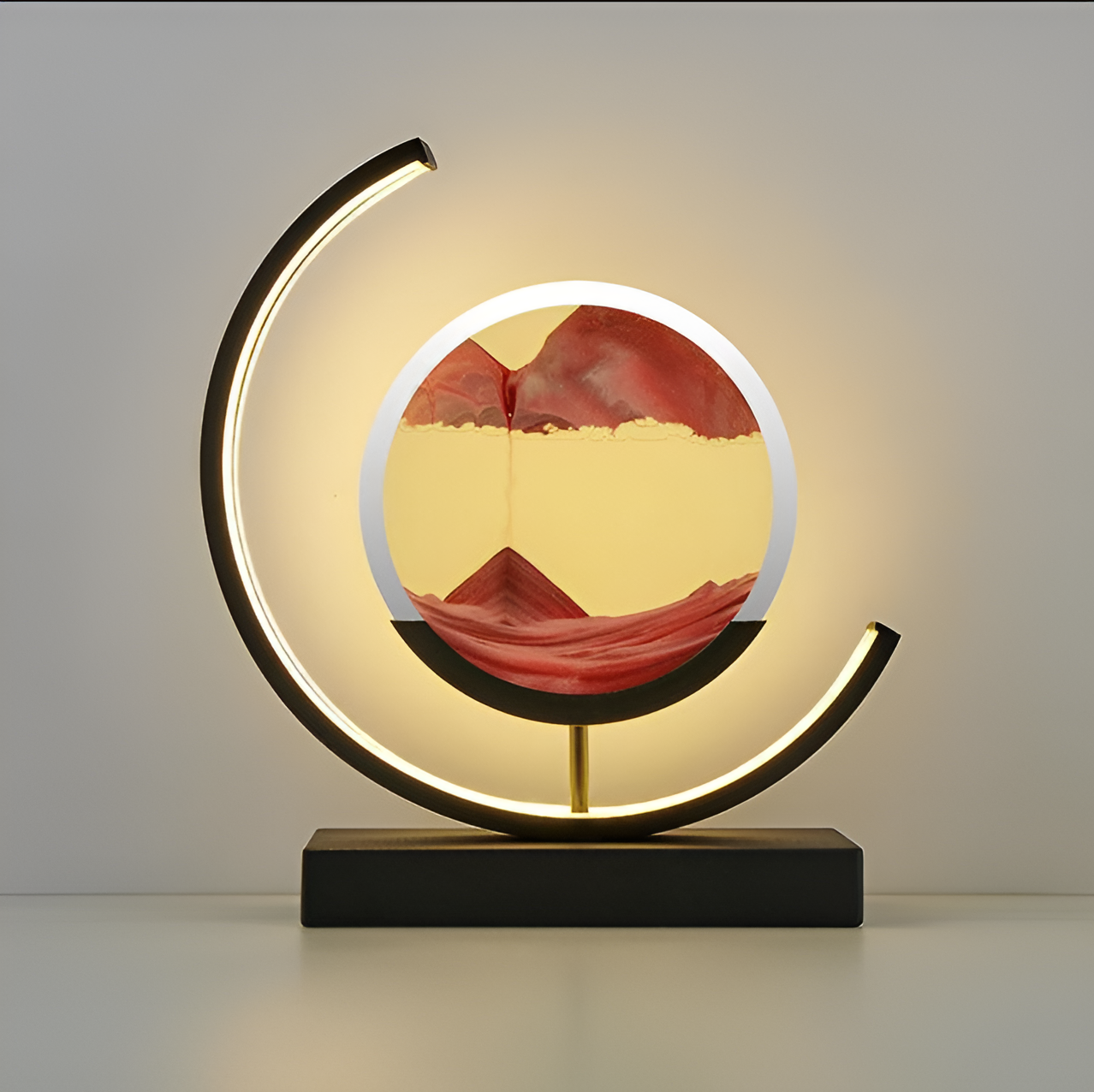 LED sand art lamp placed in a living room setting with warm ambient lighting