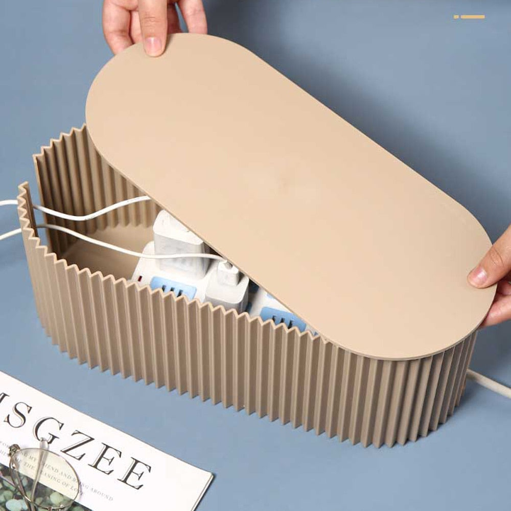 Cable management box with side openings for organized cord routing on a desk