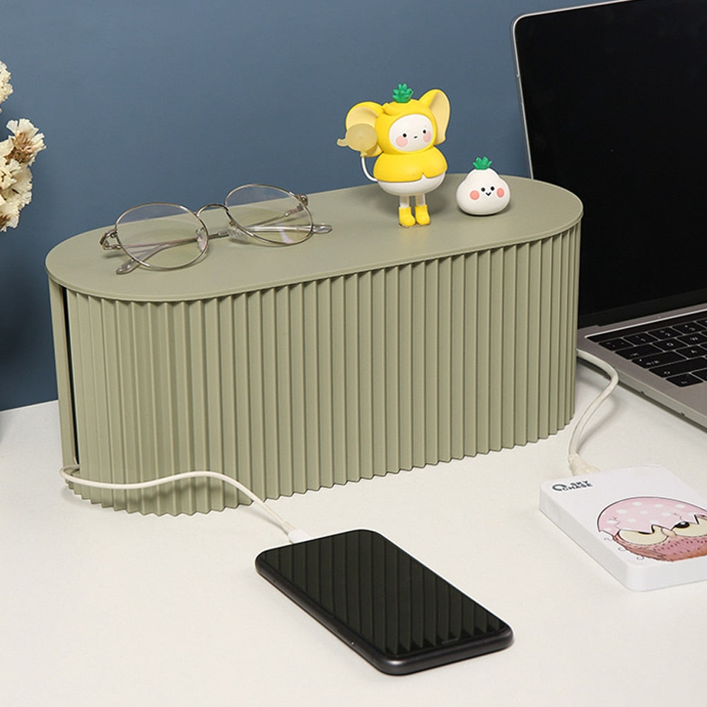 Plastic cable organizer box with lid removed showing cable storage compartment