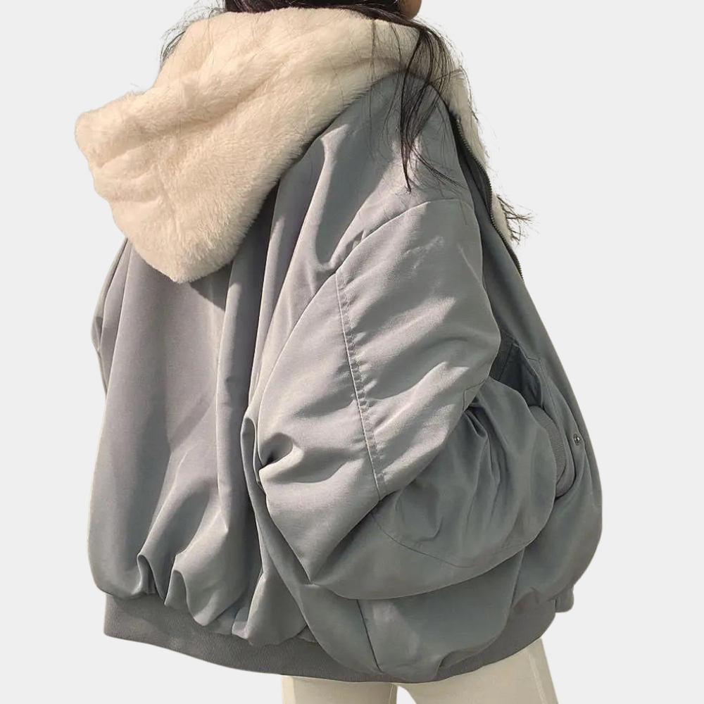Women's oversized jacket worn over layers, styled for autumn and winter outerwear