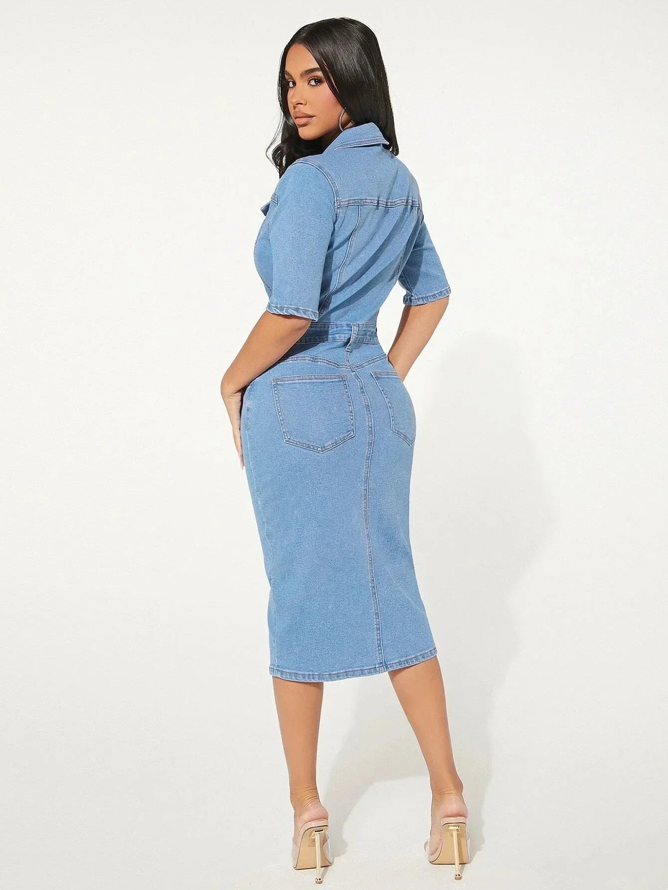 Form-fitting denim midi dress with paneled seams and straight hem with front slit
