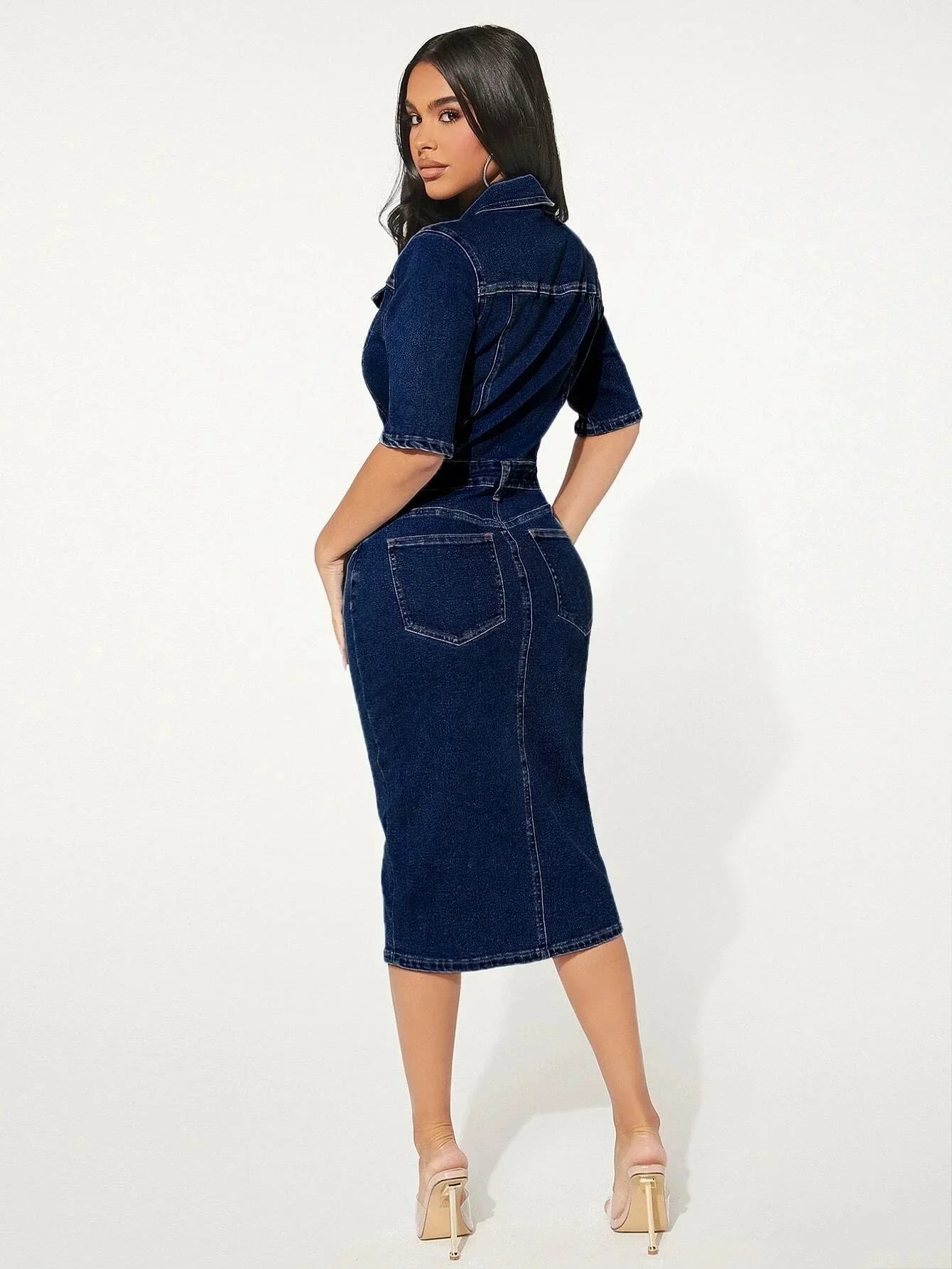 Women's form-fitting denim dress with front button detail and midi-length hem