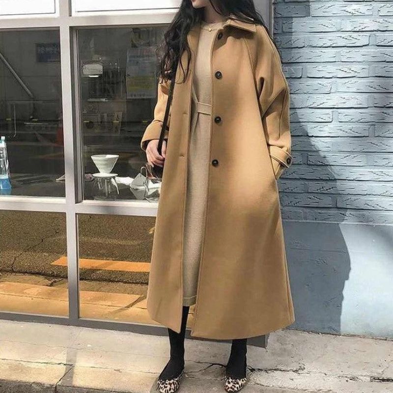 Women's long polyester coat with front button closure and turn-down collar, full-length front view