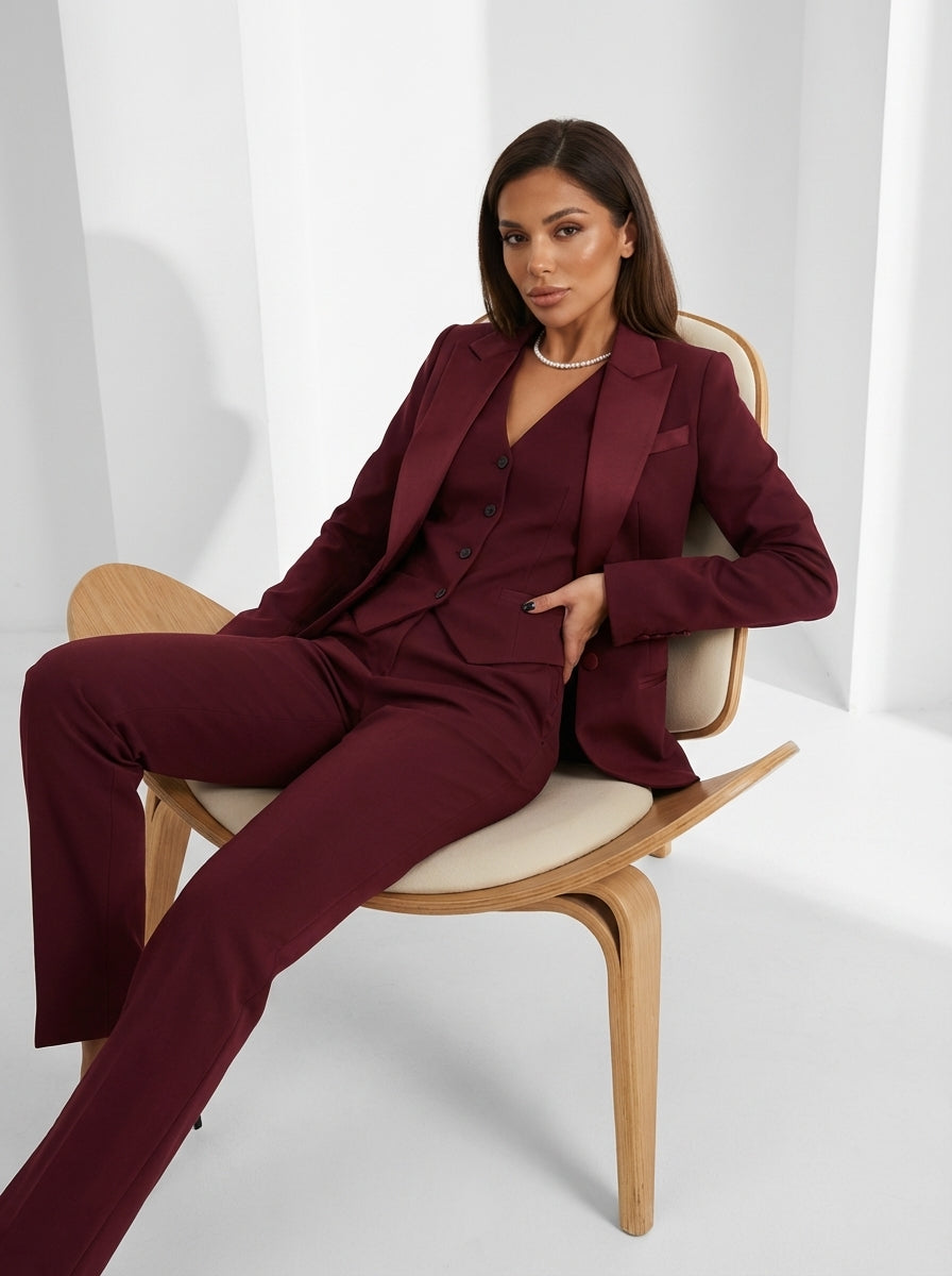 Women's tailored three-piece suit with lapel blazer, matching vest, and full-length straight trousers