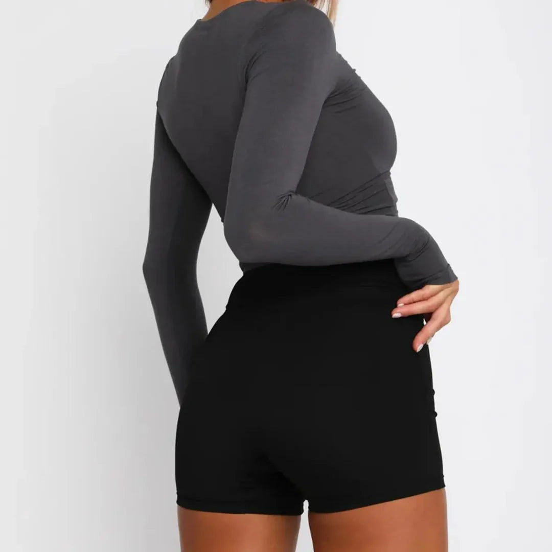 Women's cropped long-sleeve top with round neckline and body-hugging stretch fit