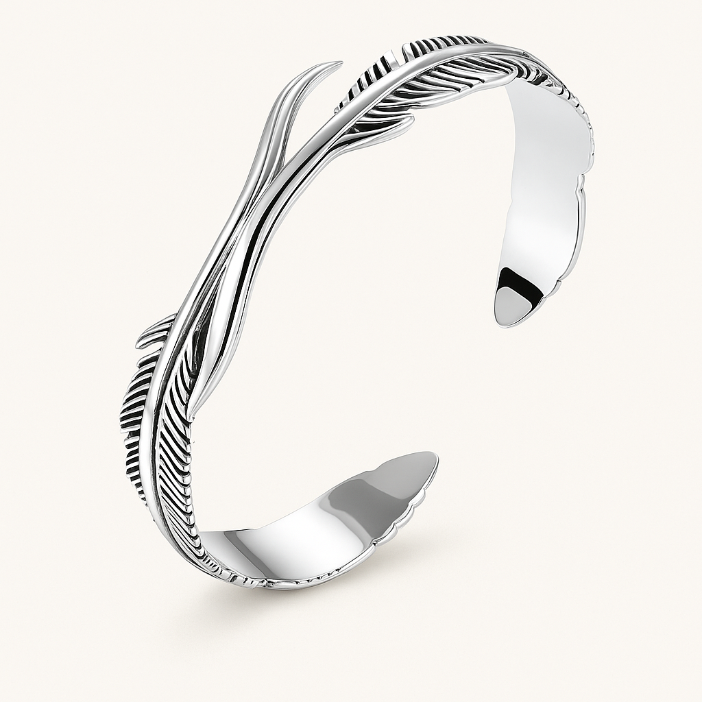 Feather motif open cuff bracelet, polished metal finish, angled view