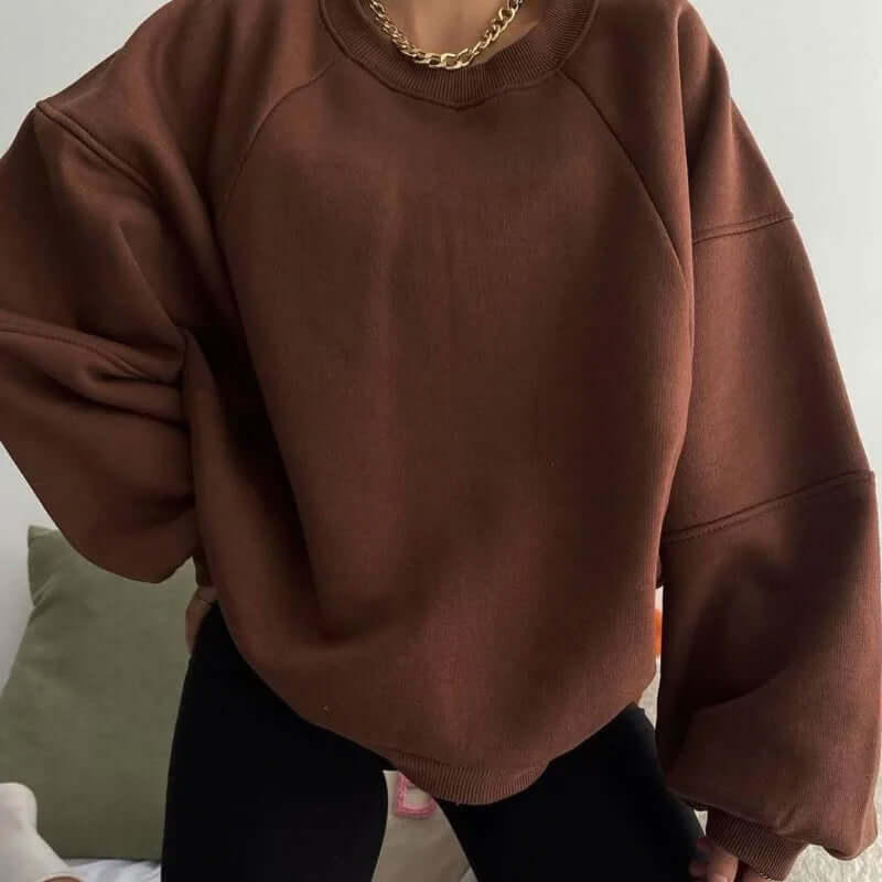 Oversized women's fleece sweater with dropped shoulders — detail close-up