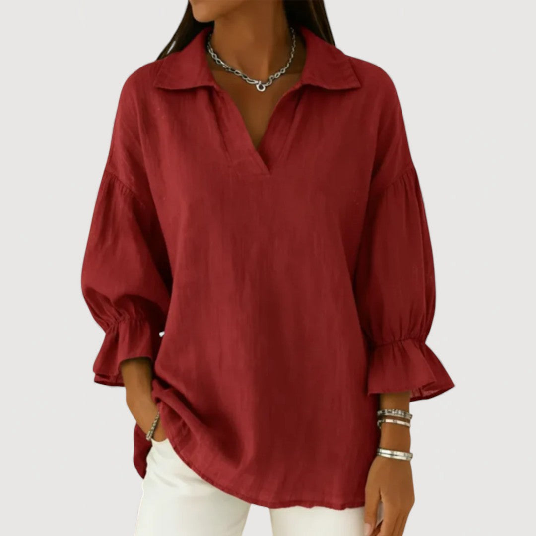 Elegant women's blouse with V-neckline and flowing puff sleeves