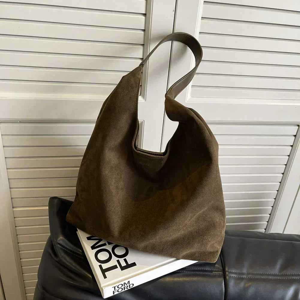 Versatile tote bag with wide strap designed for work and daily use