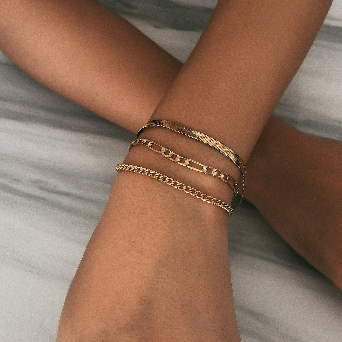 Women's metal bangle with layered chain design for upper arm