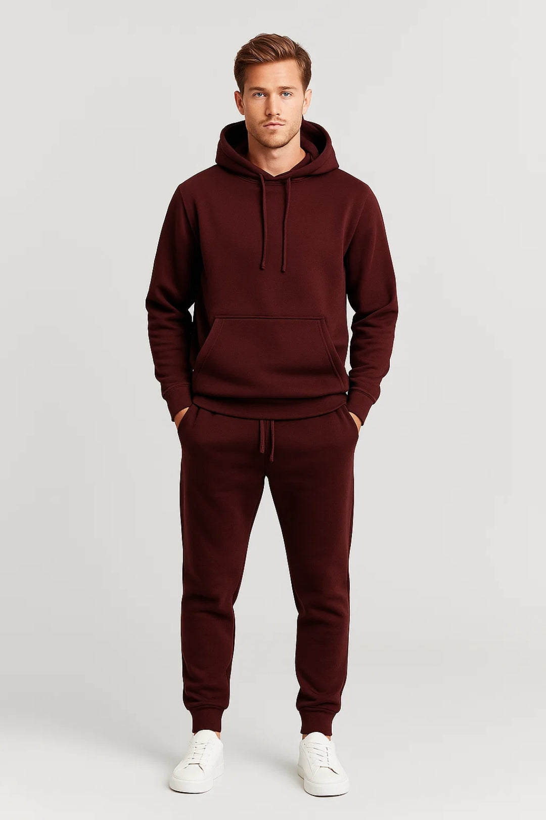 Men's hoodie and joggers set with drawstring hood, kangaroo pocket, ribbed cuffs, and tapered joggers with elastic waistband
