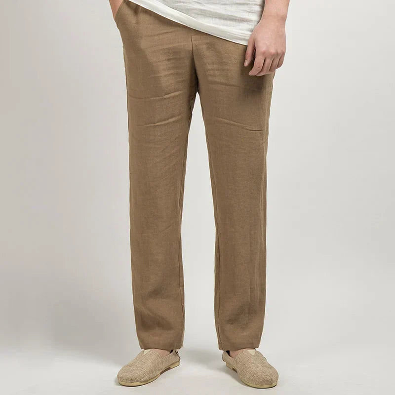 Men's straight-leg linen trousers with a relaxed drape, full-length cut, and structured silhouette