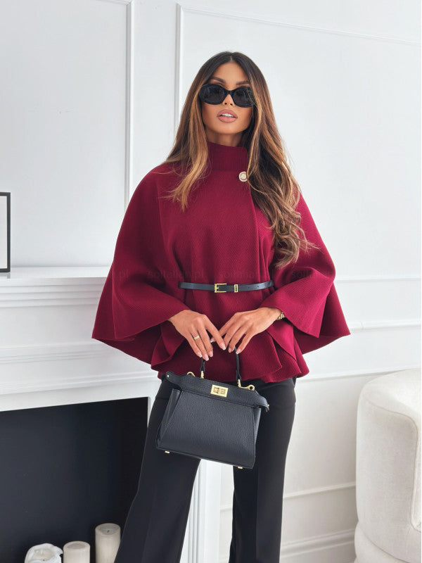 Structured knit women's top with flared hem, high collar, and waist-defining belt