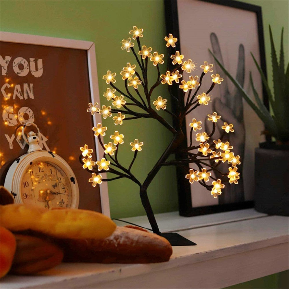 LED Cherry Blossom Lamp with flexible branches and flower-shaped LED lights illuminated