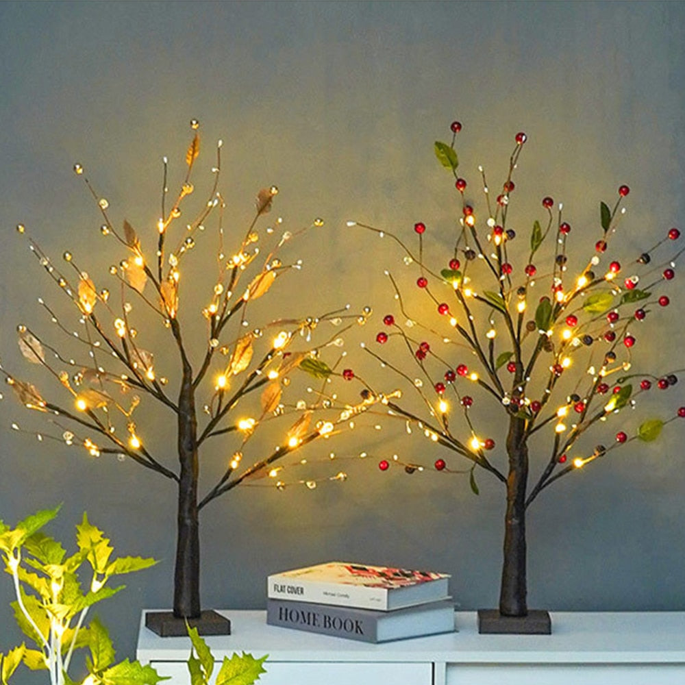 Close-up of LED fir tree branches with decorative berries and soft warm lighting