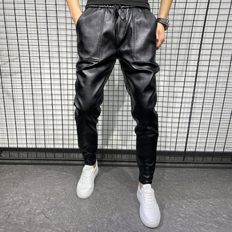 Men's faux leather joggers with elastic drawstring waistband and tapered leg