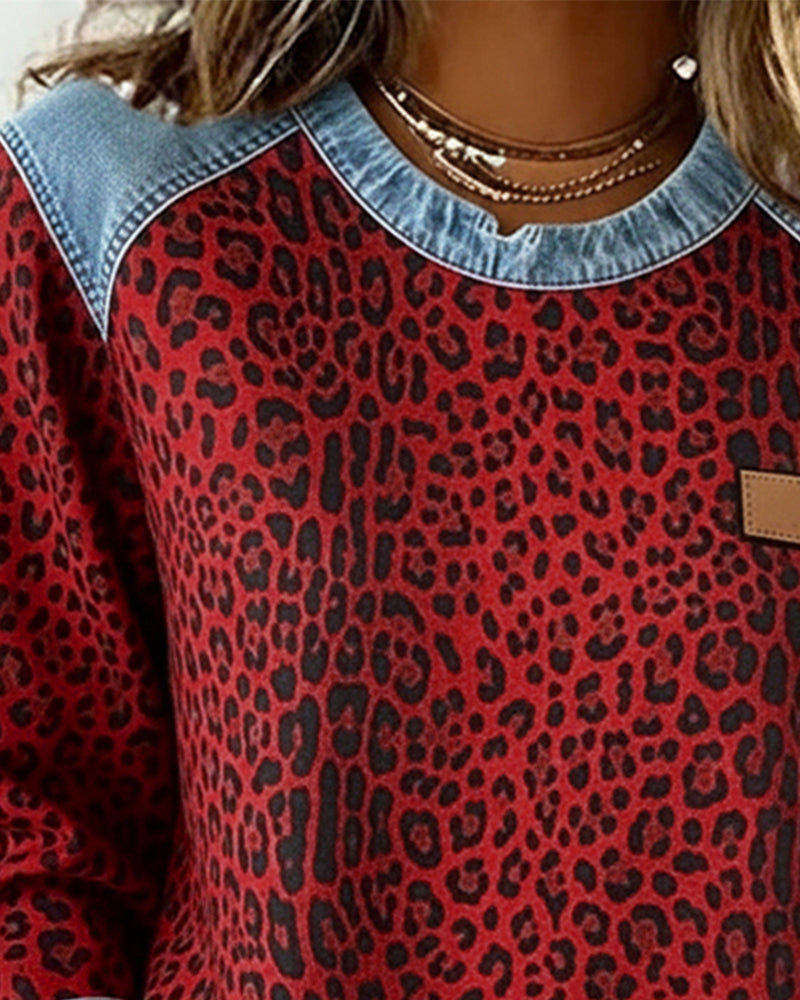 Women's leopard print top with all-over animal print and denim contrast details