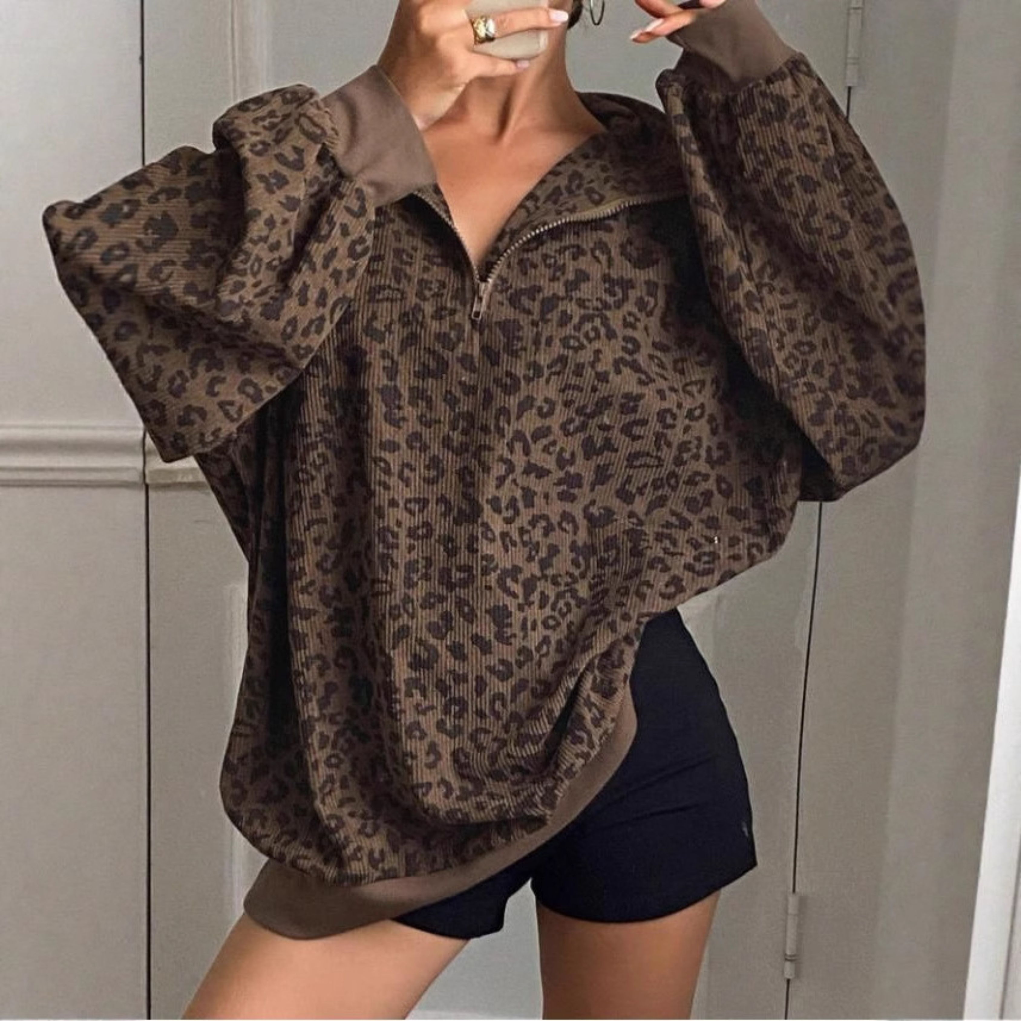 Women's ribbed knitted sweater with half-zip and all-over pattern in a relaxed silhouette