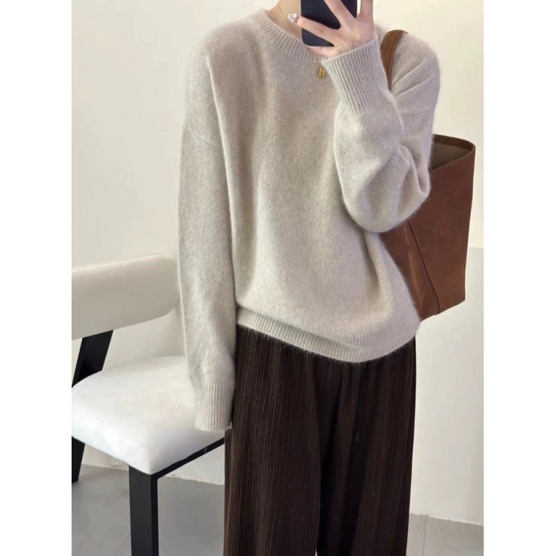 Women's fuzzy pullover sweater flat lay showing full garment shape