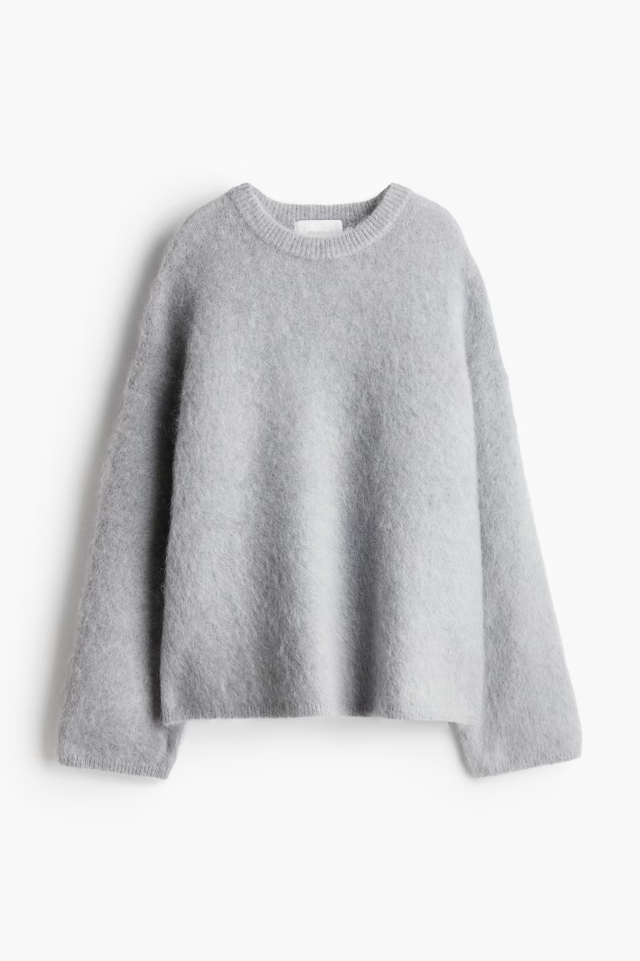 Close-up of fuzzy knit texture on women's soft pullover sweater
