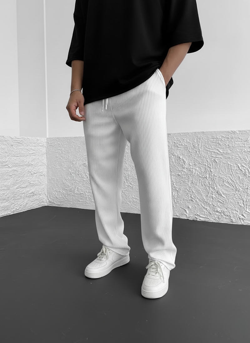 Men's relaxed trousers featuring a ribbed fabric texture and adjustable drawstring