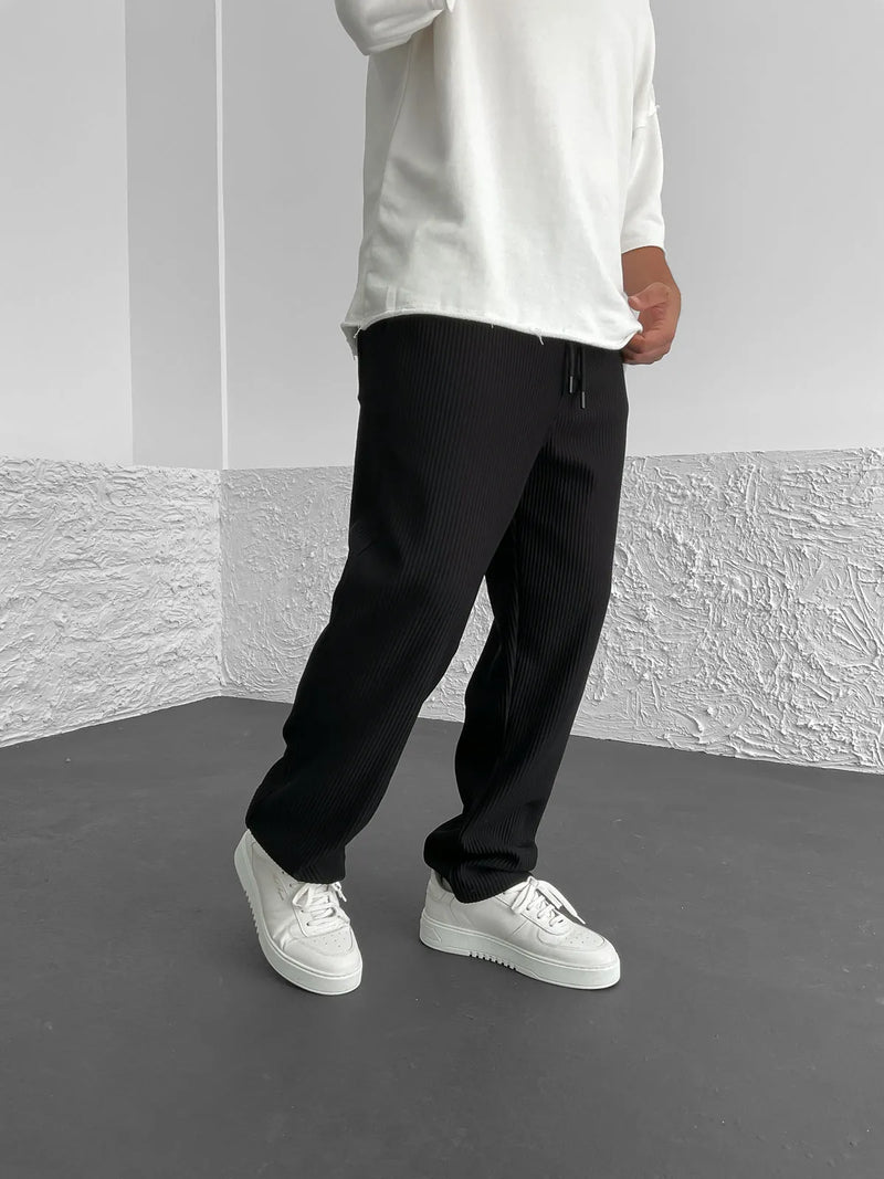 Men's full-length drawstring trousers with ribbed texture and side pockets