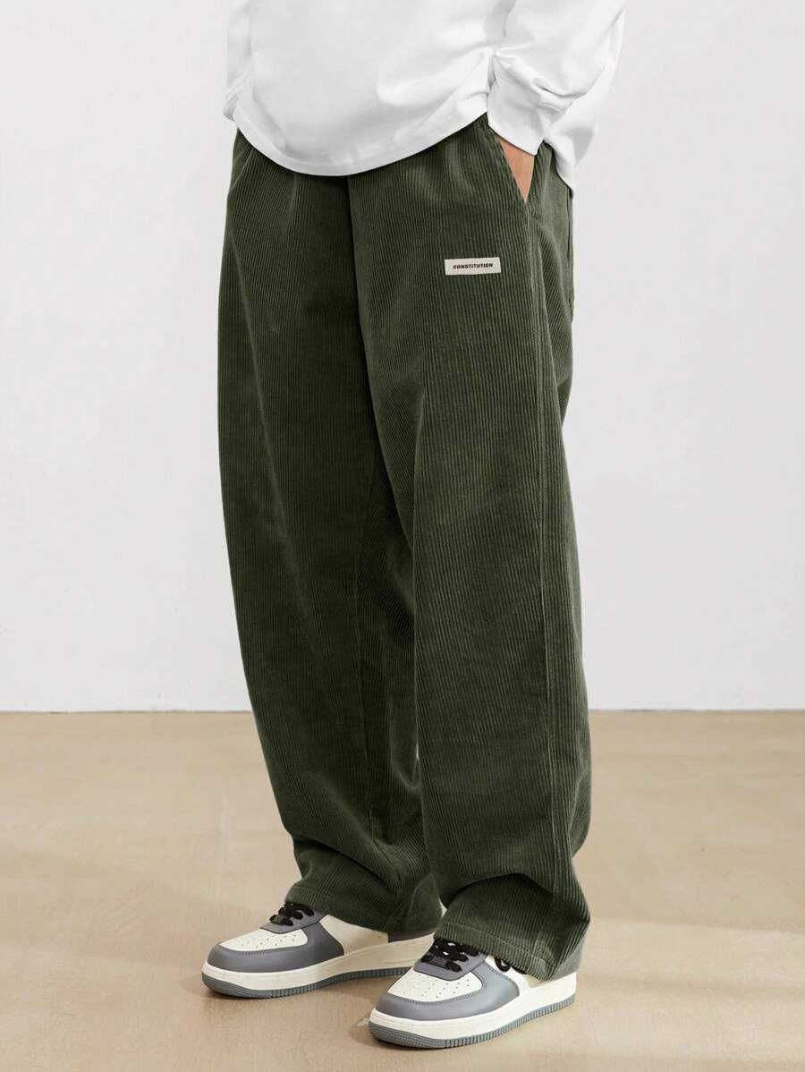 Men's wide fit corduroy trousers with relaxed silhouette, full-length front view