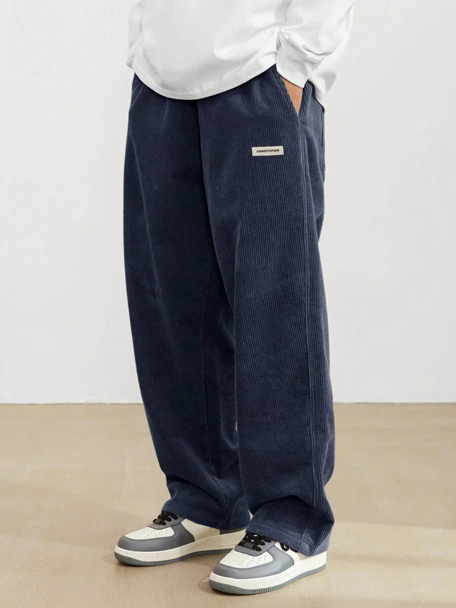 Men's relaxed corduroy trousers, waistband and side pocket detail view
