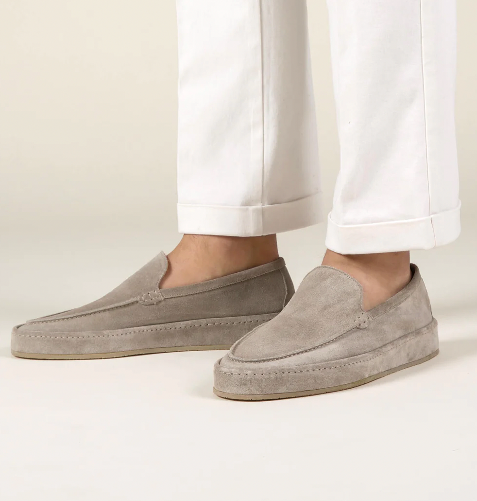 Interior view of men's suede slip-on loafers showing cushioned insole
