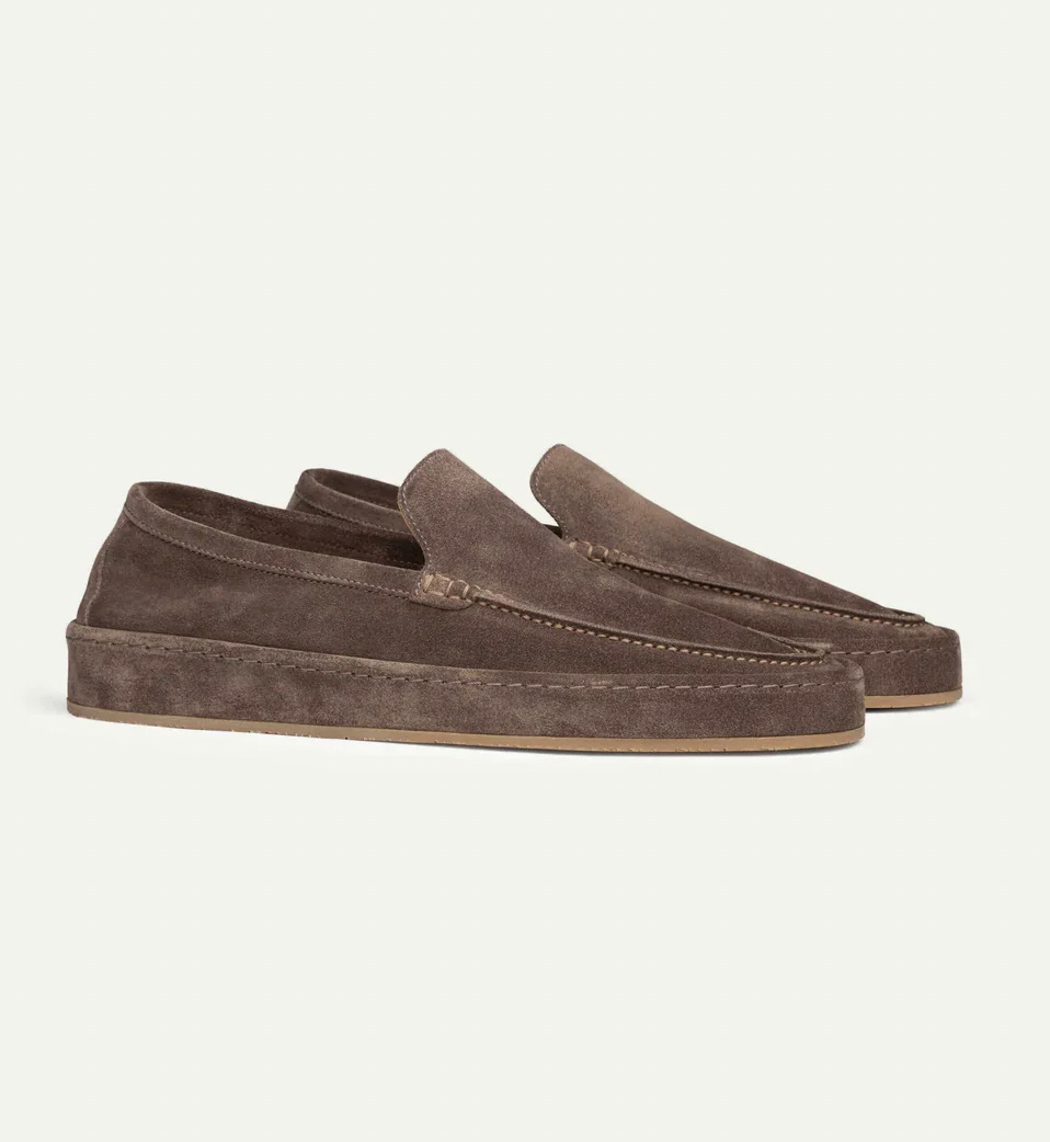 Pair of men's classic suede slip-on loafers displayed side by side