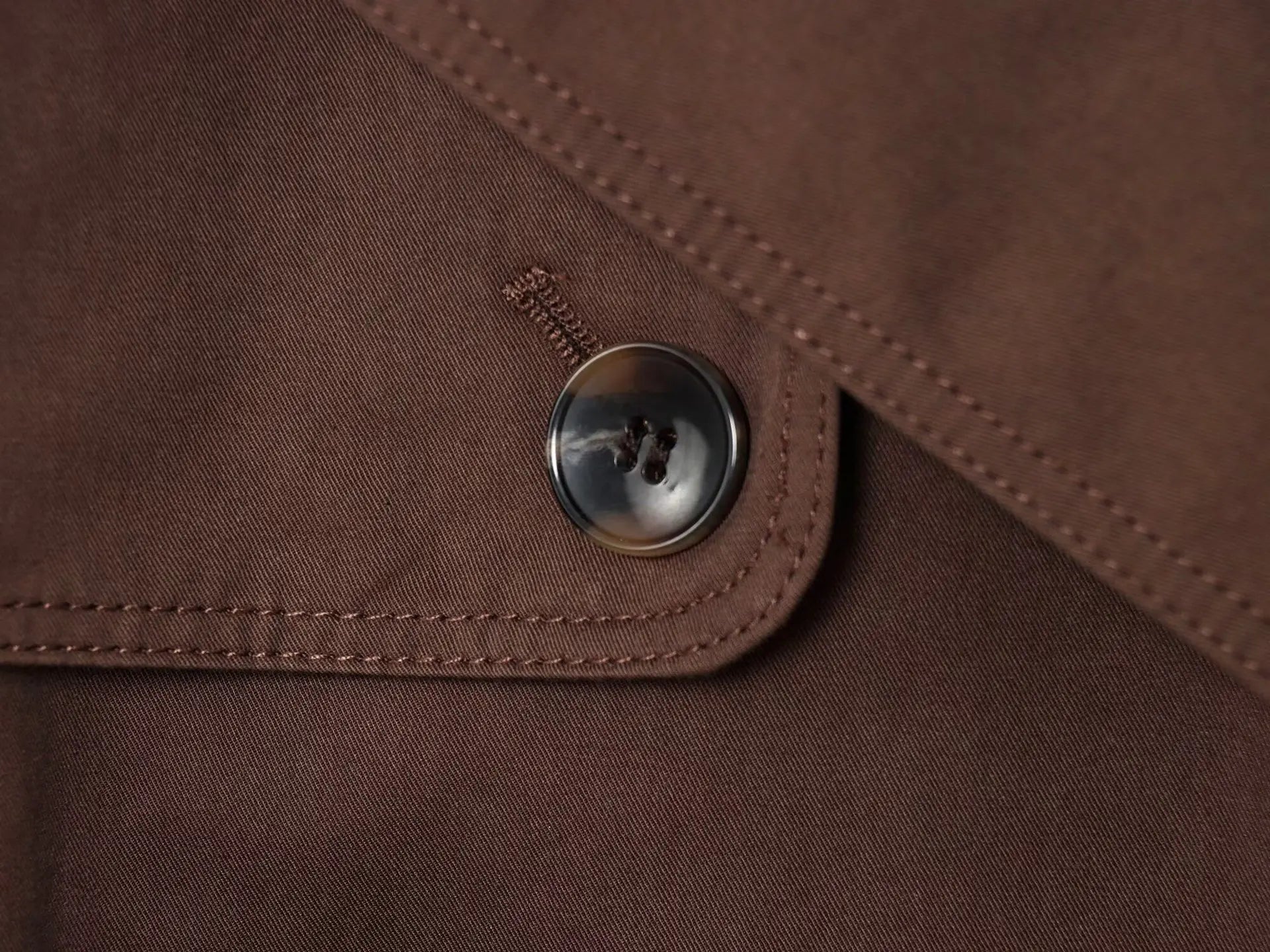 Women's structured jacket with wrap design and front button closure