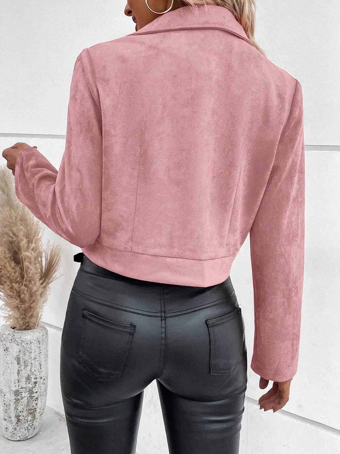 Biker-style women's jacket with long sleeves and metal zipper accents