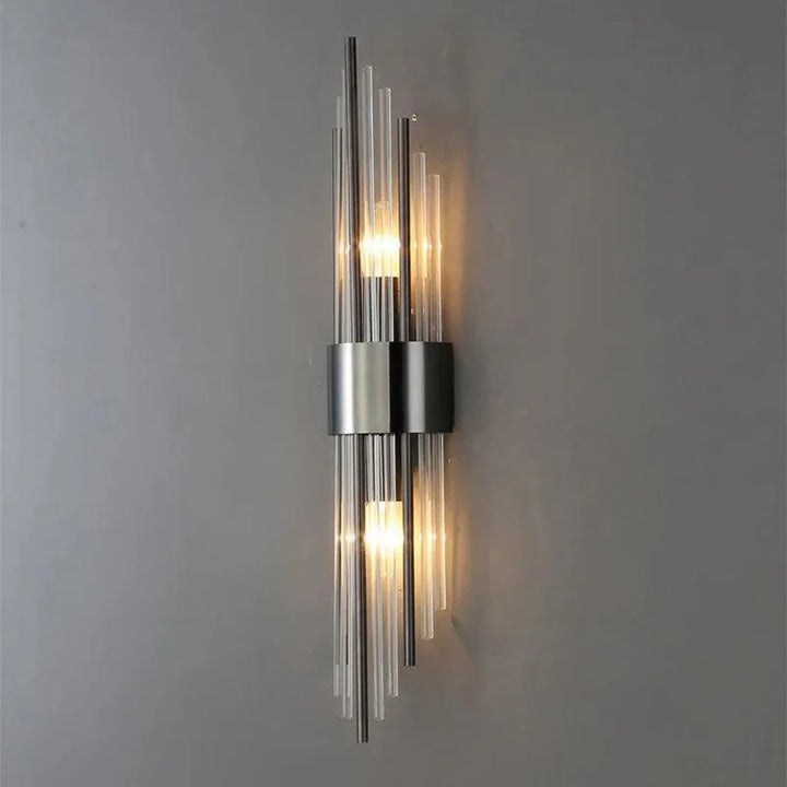 Wall-mounted metal and glass lamp with a vertical form, fixed installation for indoor use