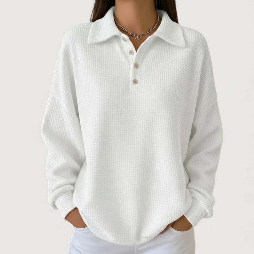 Relaxed-fit women's waffle-knit sweater with ribbed cuffs and collar