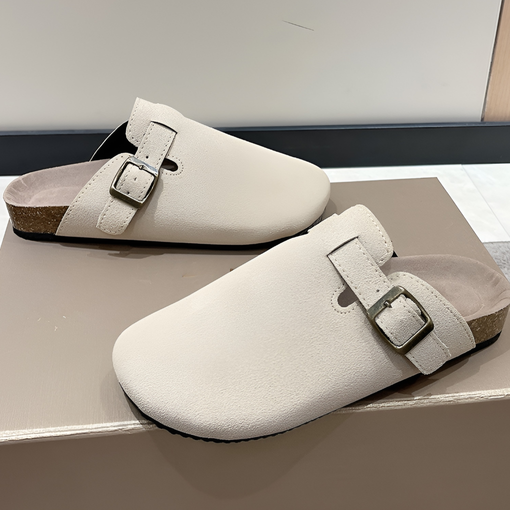 Men's closed-toe suede slippers with adjustable buckle strap in a neutral tone