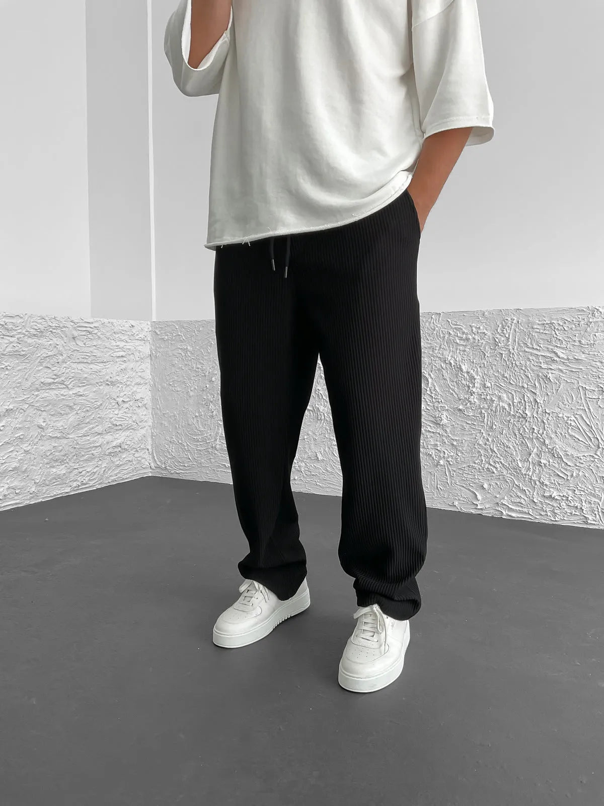 Men's relaxed fit corduroy pants — waistband and drawstring detail